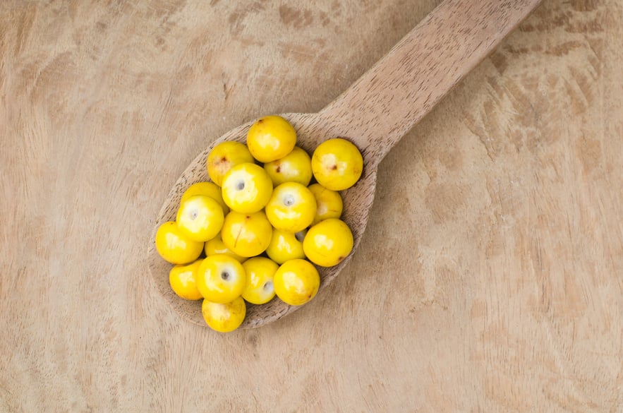 Spoon of nances on a wooden table